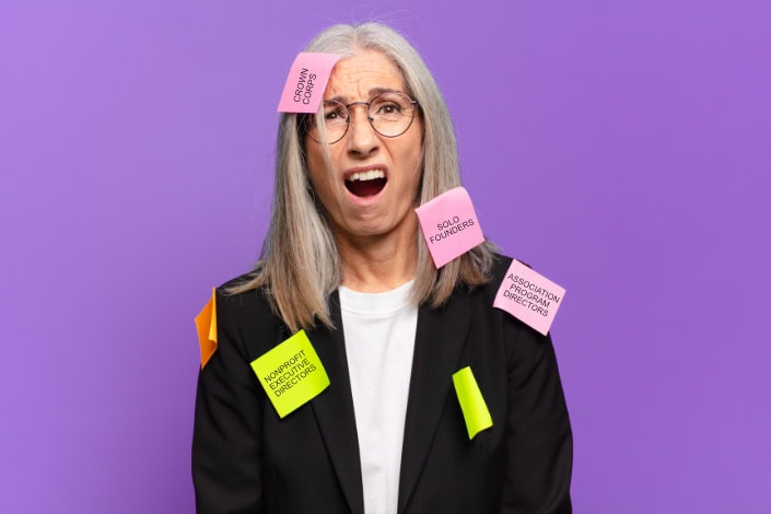 Senior consultant looks overwhelmed. She's covered in post-it notes with various ideal customer profile names on them such as "nonprofit director" and "solo founders"